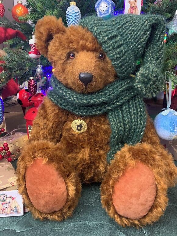 Ginger seated in his handmade green scarf and hat
