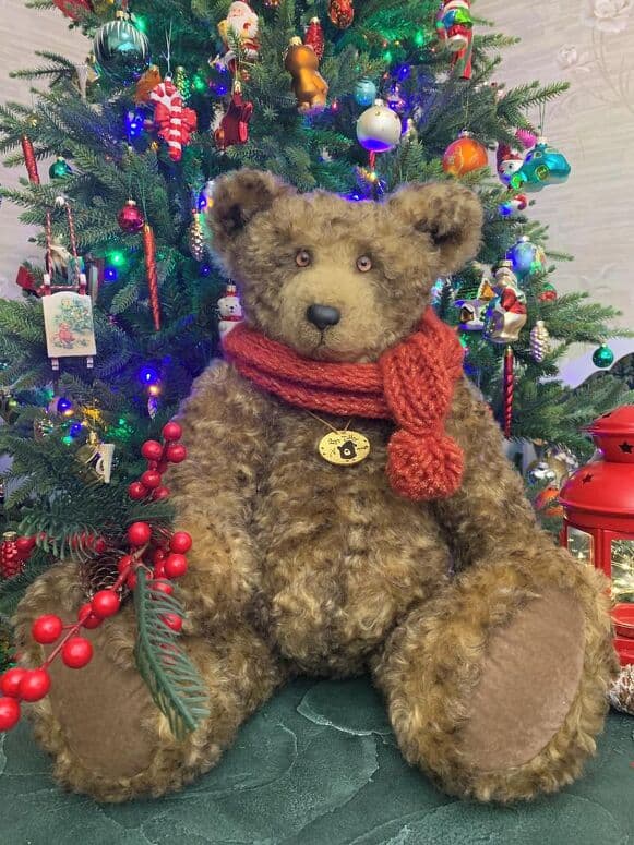 Bosphorus seated beside a decorated Christmas tree