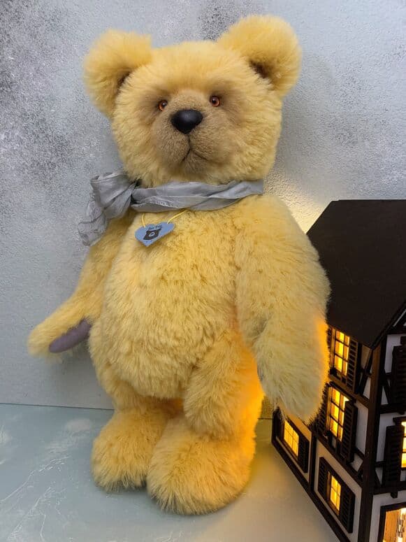 Amalfi, a lemon-gold alpaca artist bear, standing full length