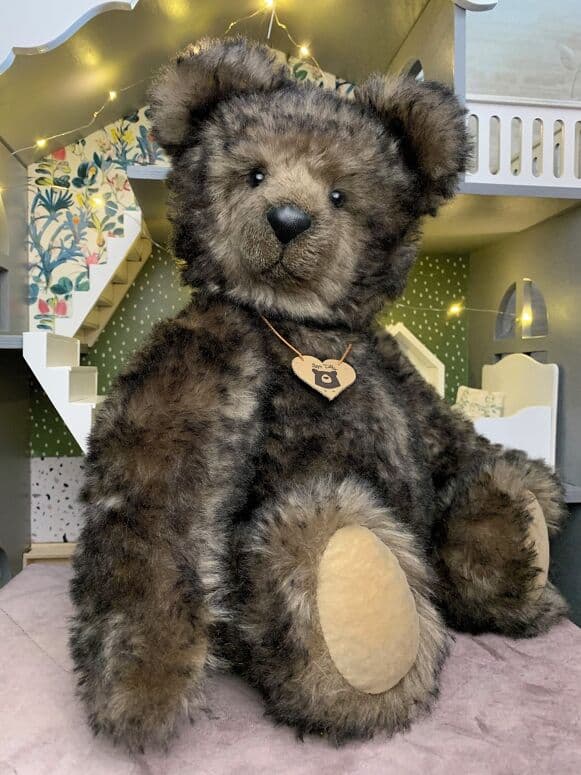 Foggy, a smoky brown mohair artist bear, seated full length