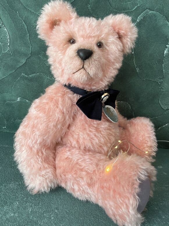 Benedict, a blush-pink kid-mohair artist bear, seated full length