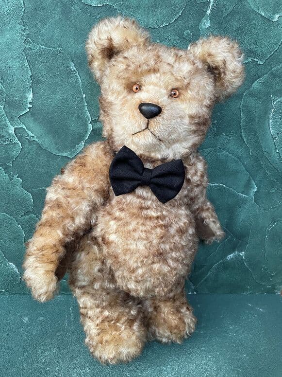 Claus, a winter-gold mohair artist bear, standing full length