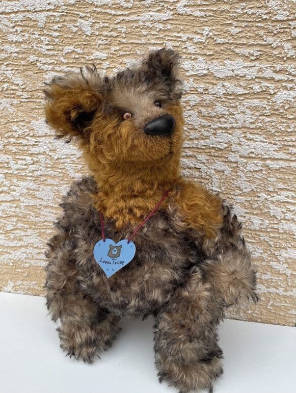 Oakley, a silky woodland mohair artist bear, seated full length